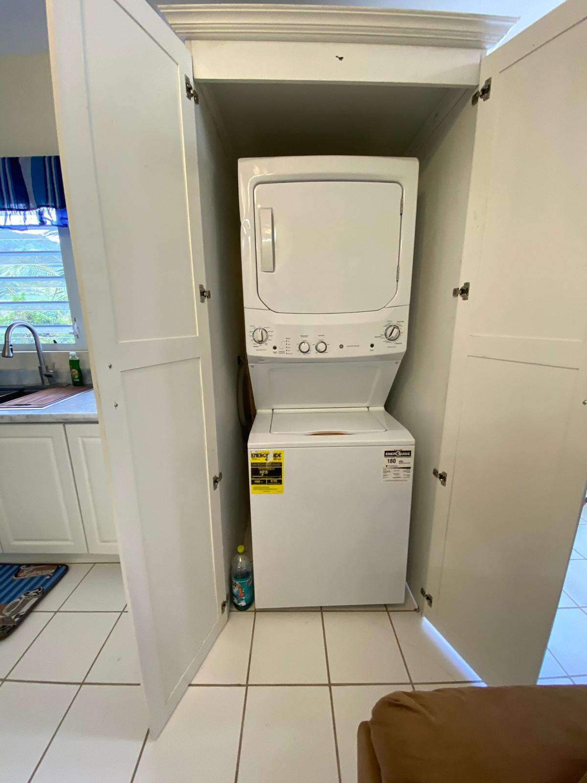 In-unit washer and dryer In-unit stacked washer and dryer in a fitted cupboard, furnished 1 bedroom apartment for rent at Crescent Hill, Basseterre
