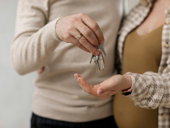 Person holding apartment keys on moving in day in St. Kitts