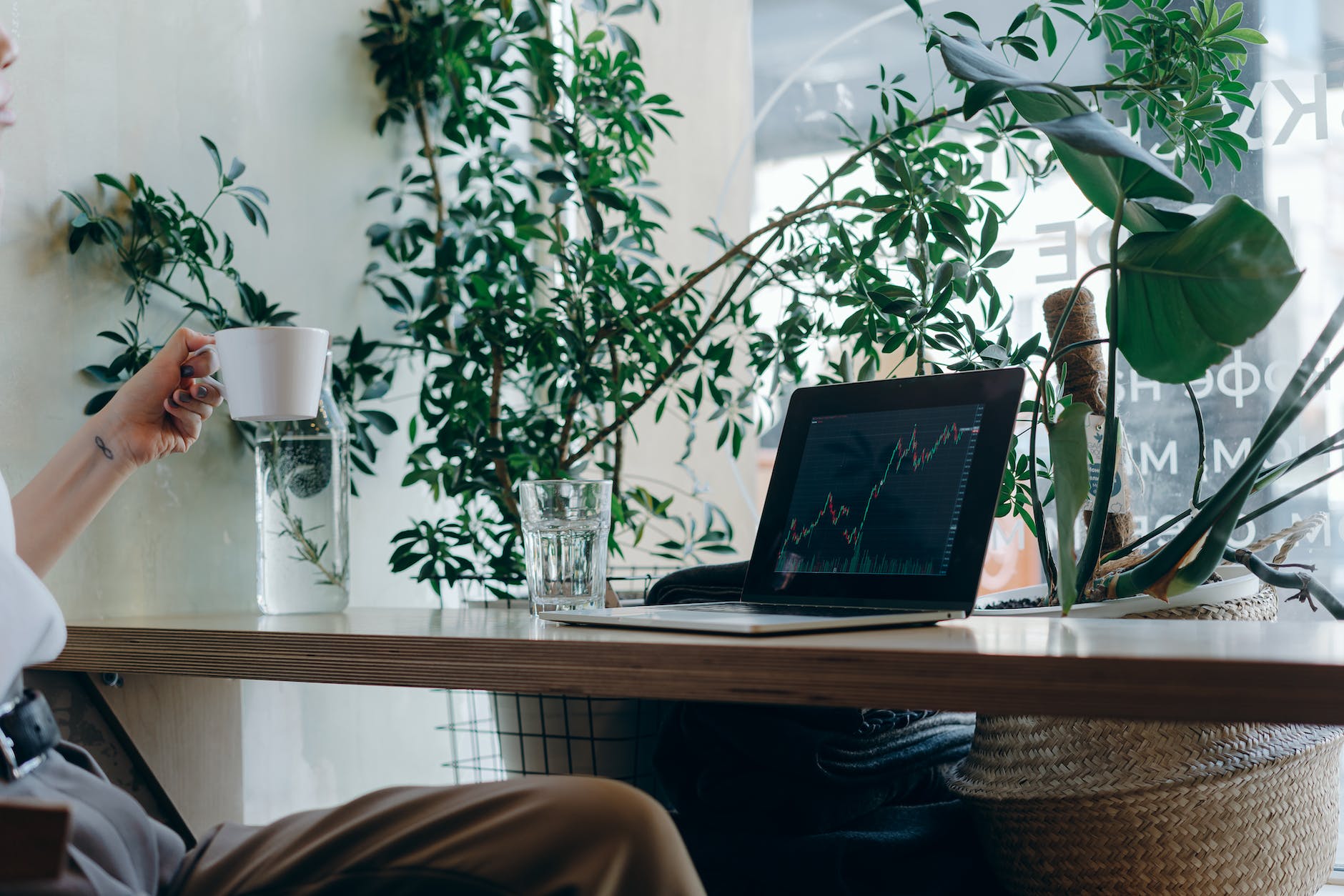 a macbook on brown wooden desk
